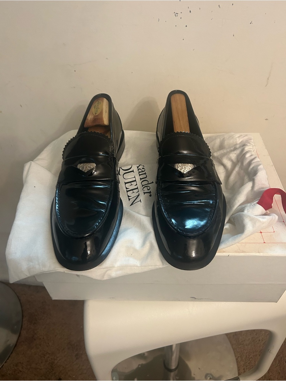 Alexander McQueen Black Patent Leather Penny Loafers with Silver Crest